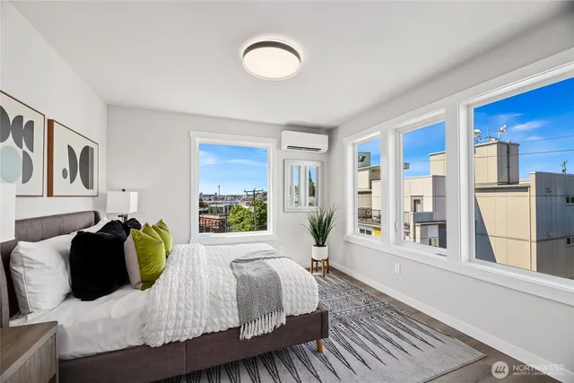 a bedroom with a large bed and a window