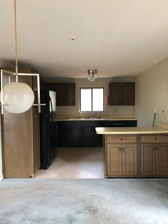37 Summersea Road Mashpee, MA 02649 - Photo 9 of 16 a kitchen with granite countertop a sink and cabinets