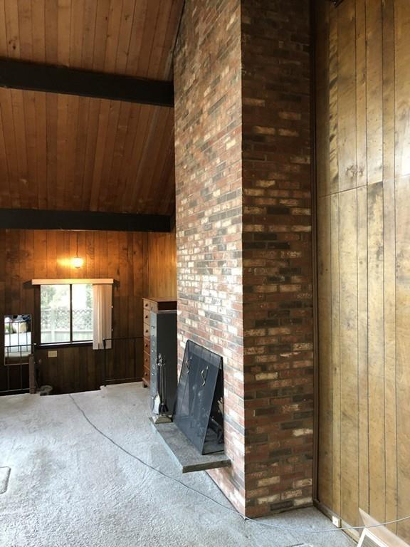 37 Summersea Road Mashpee, MA 02649 - Photo 10 of 16 a view of an empty room with a fireplace and a window