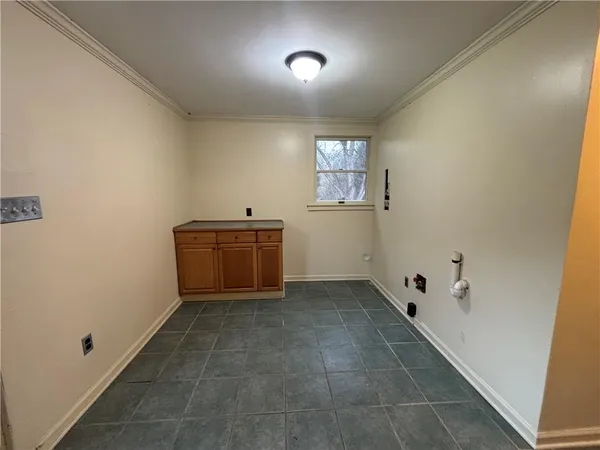 a view of a utility room with a window