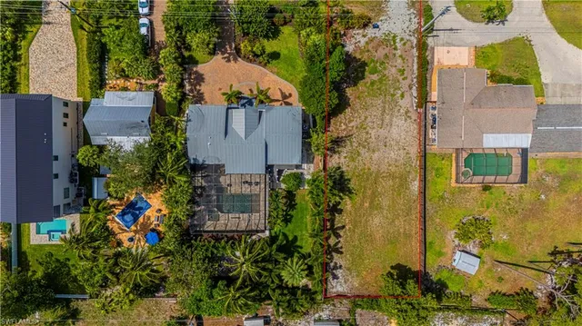 an aerial view of a house with a yard and garden