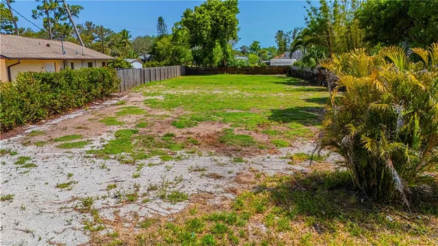 a backyard of a house with lots of green space