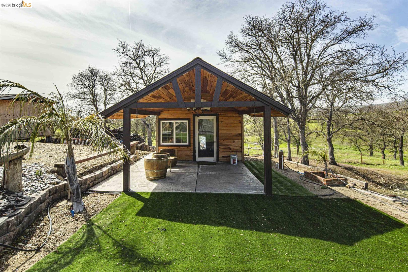 4626 Little John Road Copperopolis, CA 95228 - Photo 19 of 53 a view of a house with backyard and sitting area