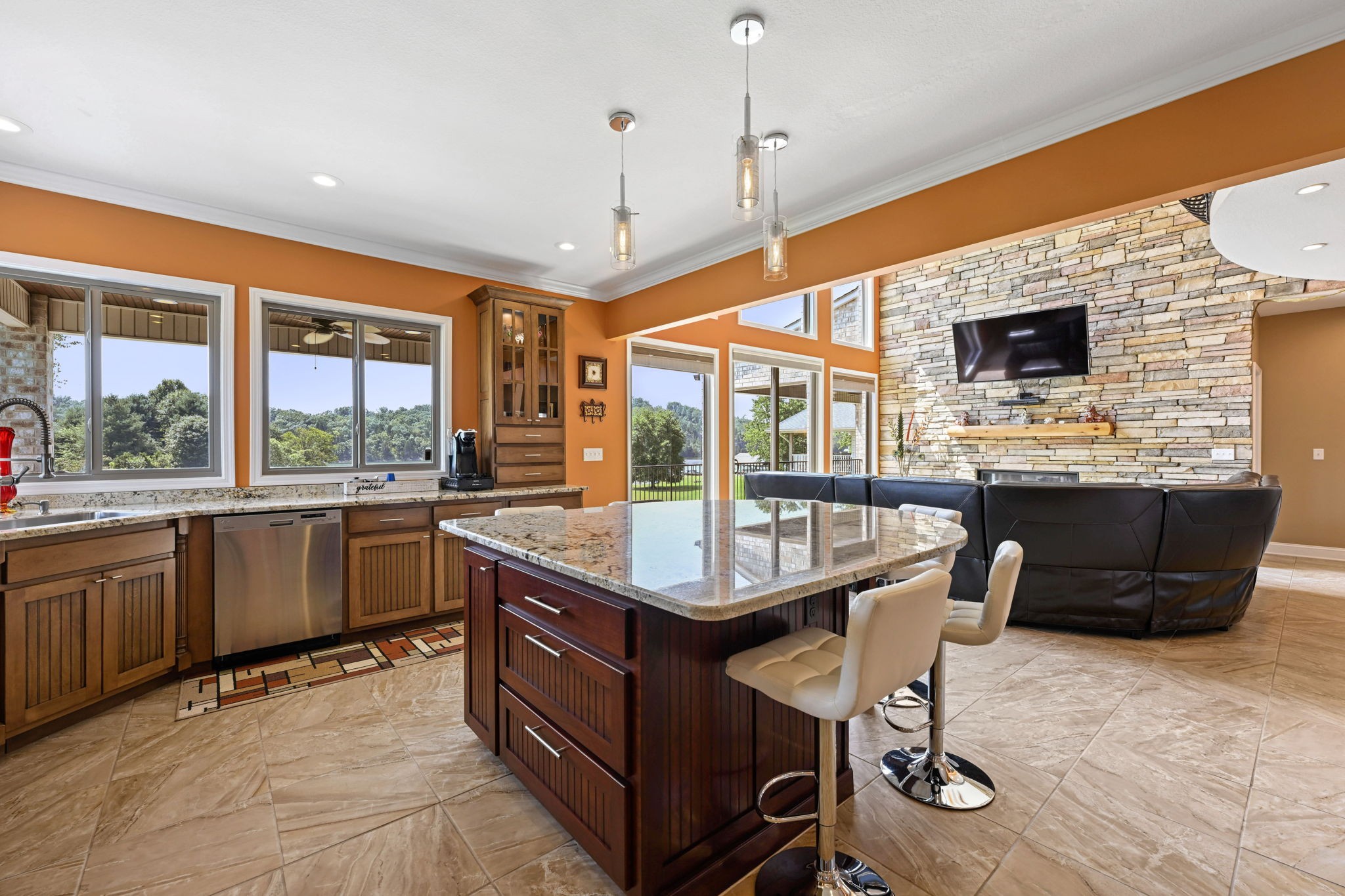 850 Sable Road Spring City, TN 37381 - Photo 13 of 56 a kitchen with a stove a sink a counter top space and living room view