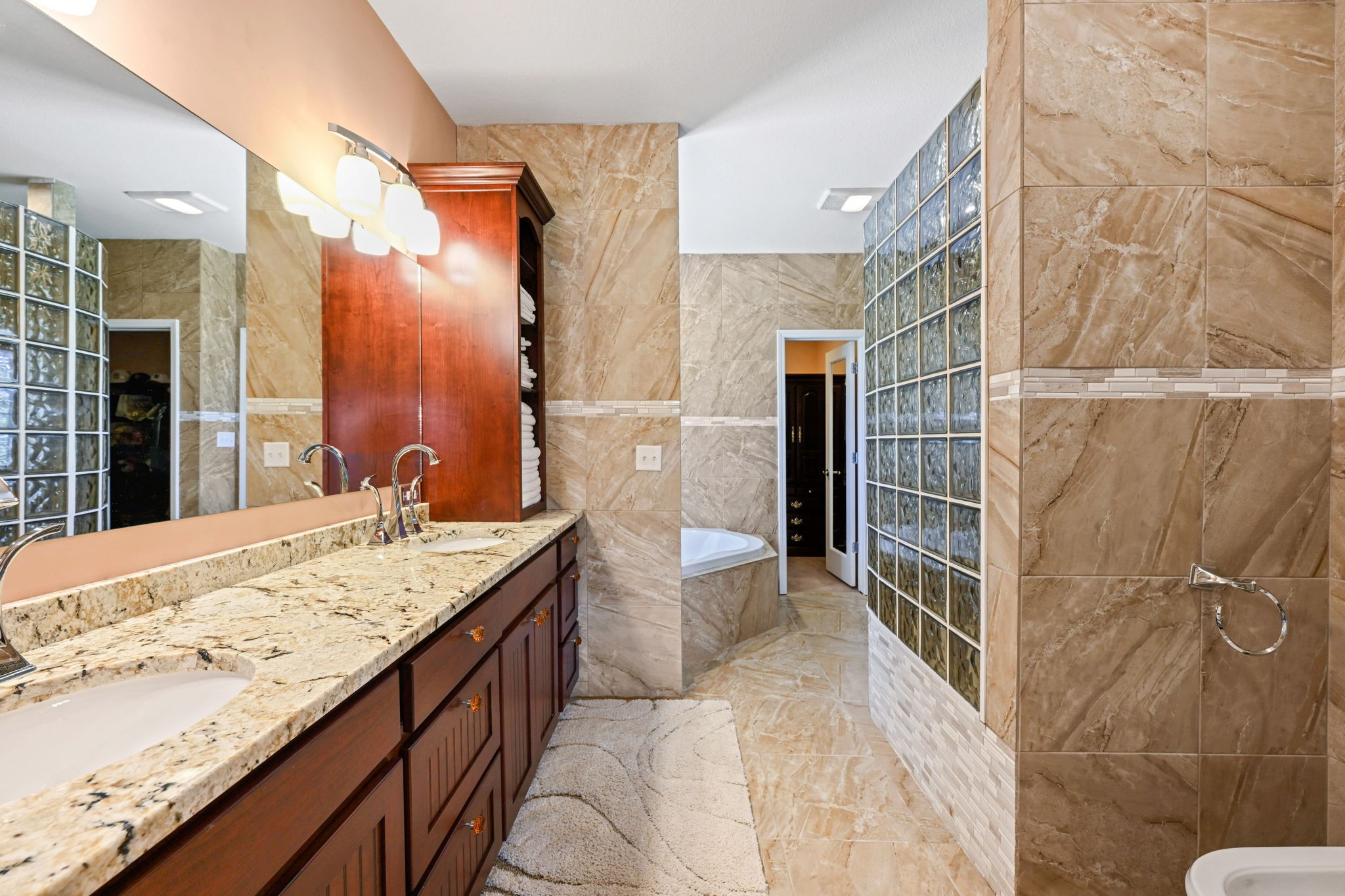 850 Sable Road Spring City, TN 37381 - Photo 24 of 56 a bathroom with a granite countertop sink and shower