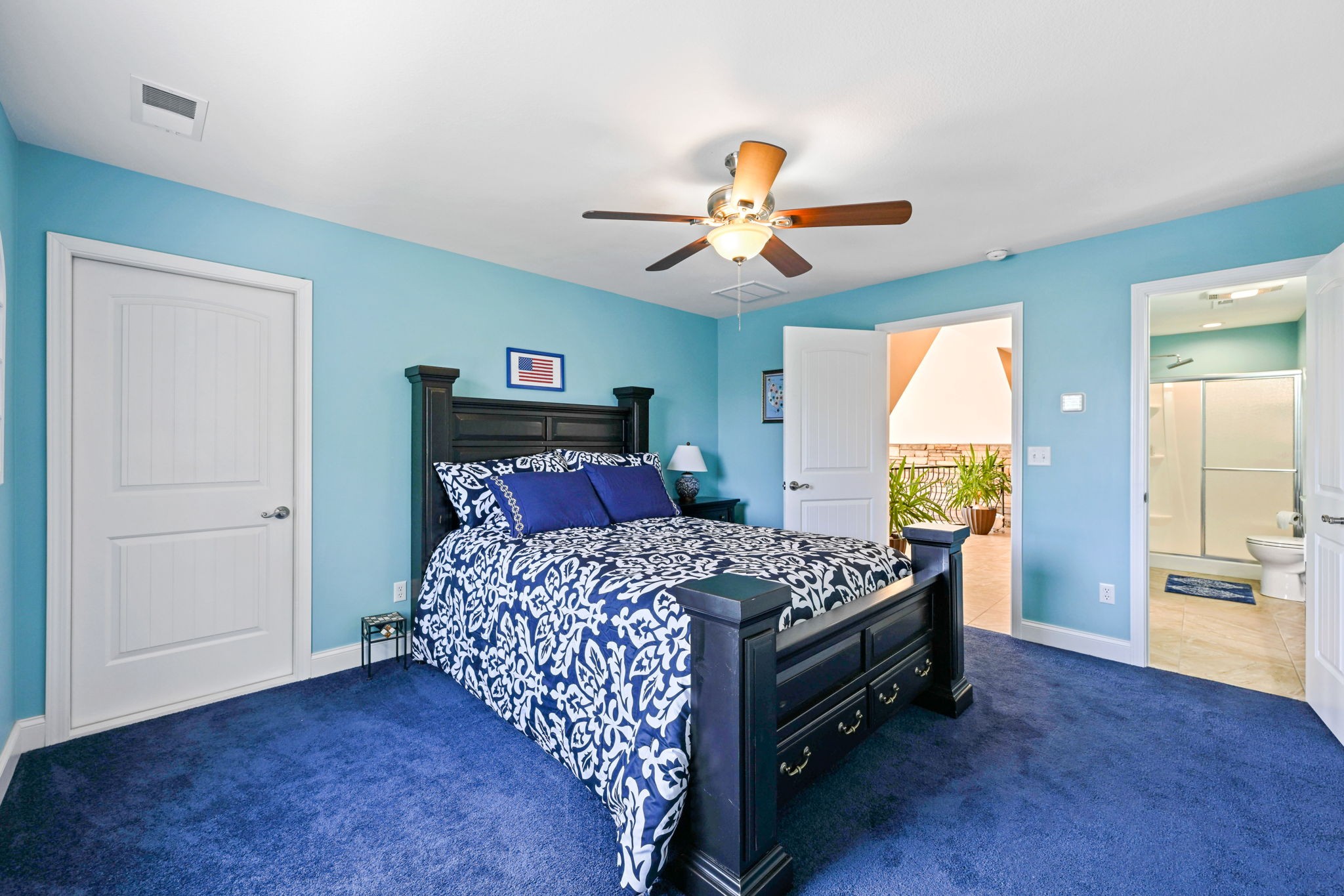 850 Sable Road Spring City, TN 37381 - Photo 30 of 56 a bedroom with a bed and a chandelier