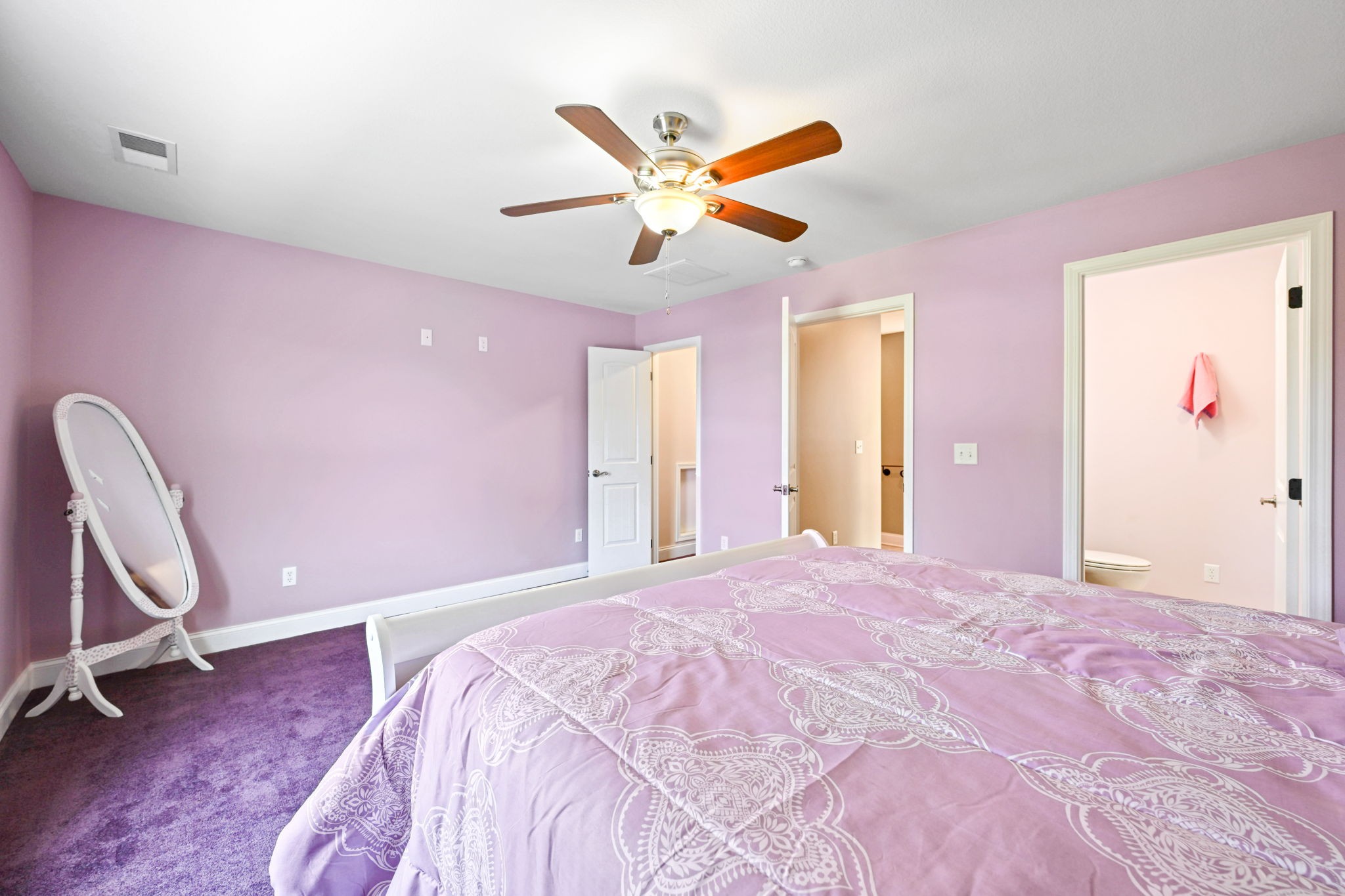 850 Sable Road Spring City, TN 37381 - Photo 35 of 56 a bedroom with a bed and a chandelier