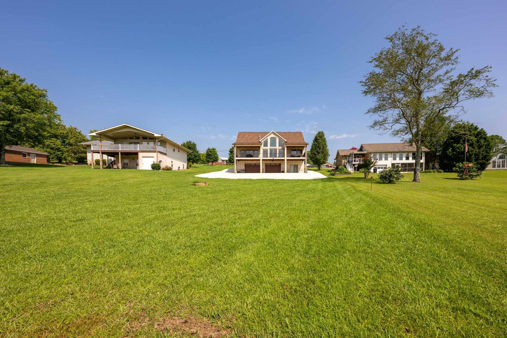 850 Sable Road Spring City, TN 37381 - Photo 49 of 56 a front view of a house with a garden and trees