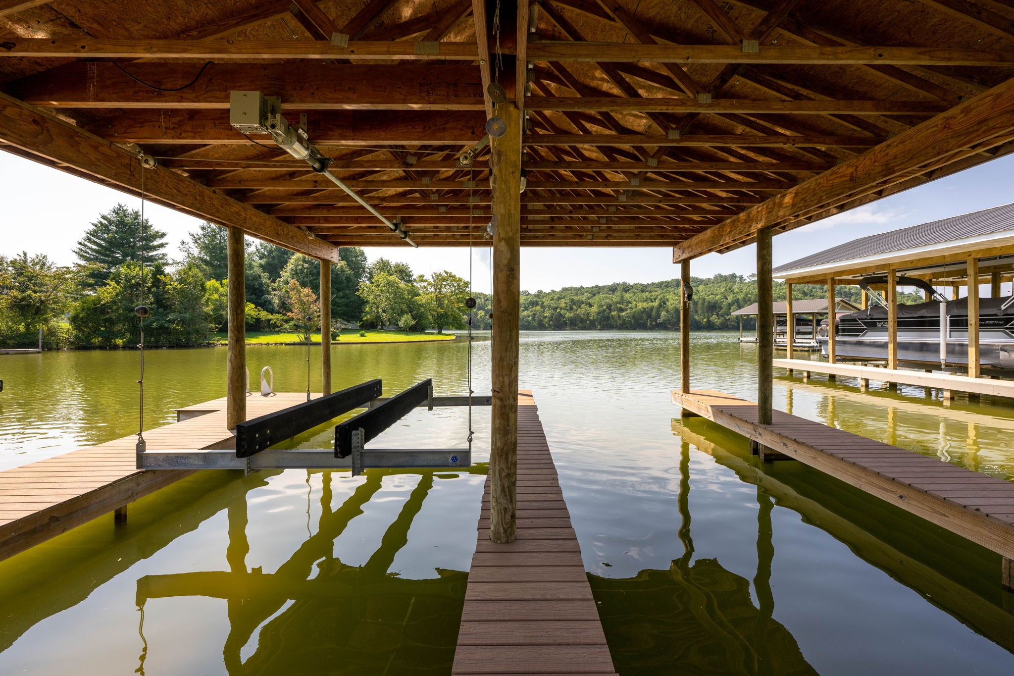 850 Sable Road Spring City, TN 37381 - Photo 50 of 56 a view of a swimming pool with wooden floor and lake view
