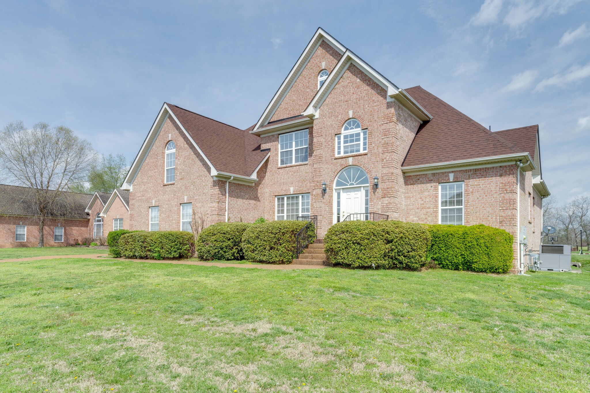 a front view of a house with a yard