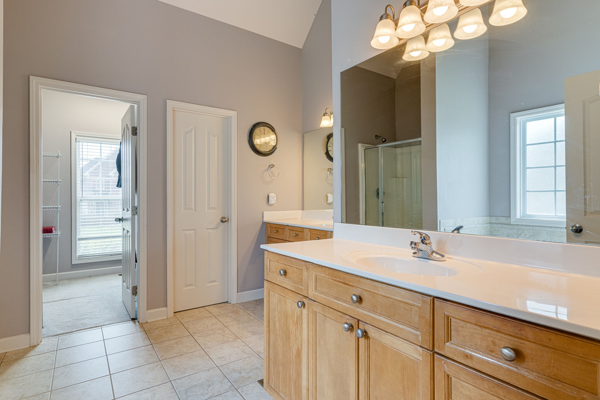 1028 Grider Drive Gallatin, TN 37066 - Photo 20 of 47 a spacious bathroom with a sink a mirror and a shower