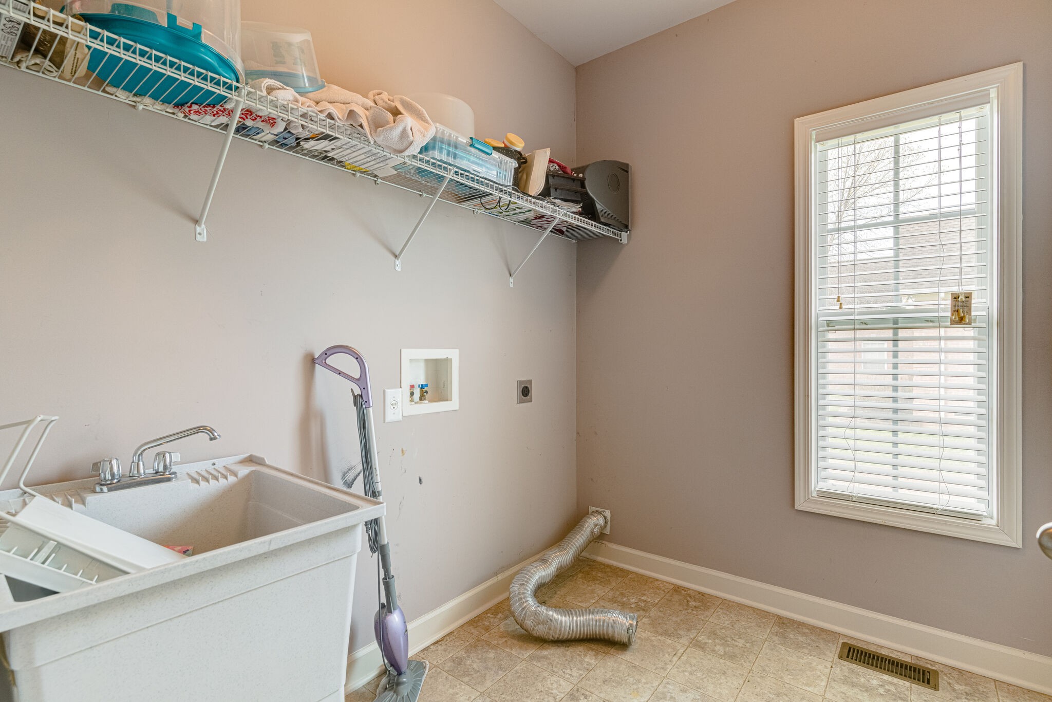 1028 Grider Drive Gallatin, TN 37066 - Photo 25 of 47 a bathroom with a sink and washing machine