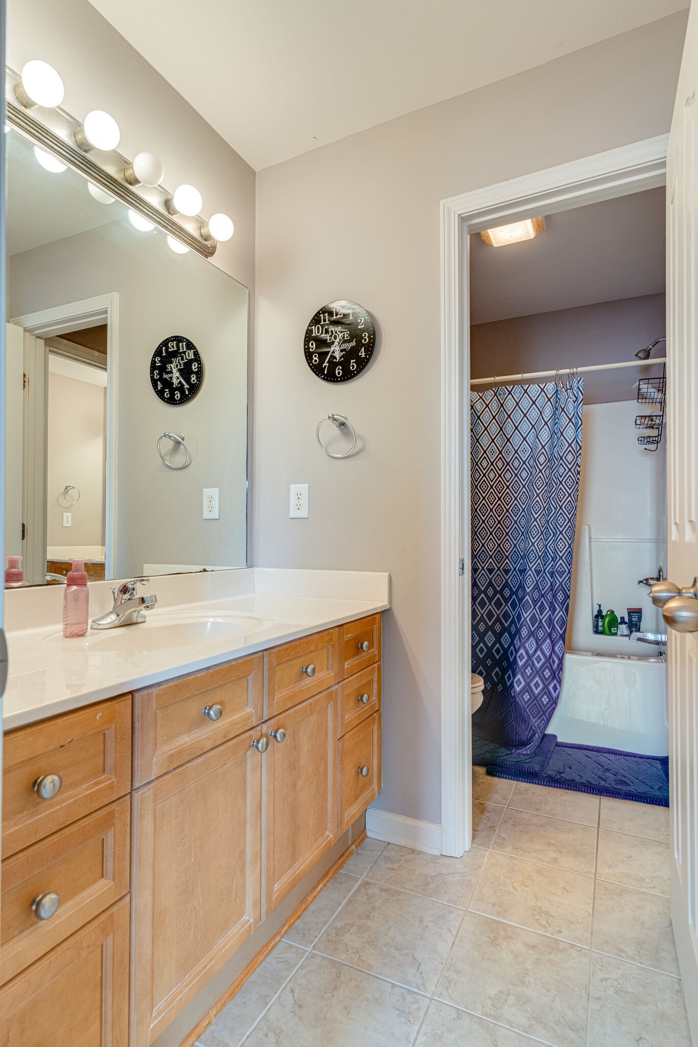 1028 Grider Drive Gallatin, TN 37066 - Photo 34 of 47 a spacious bathroom with a double vanity sink and a mirror