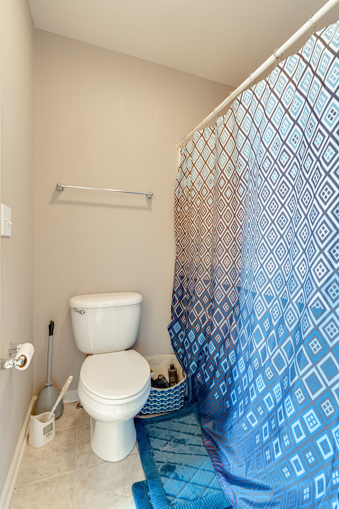 1028 Grider Drive Gallatin, TN 37066 - Photo 35 of 47 a white toilet sitting next to a shower curtain