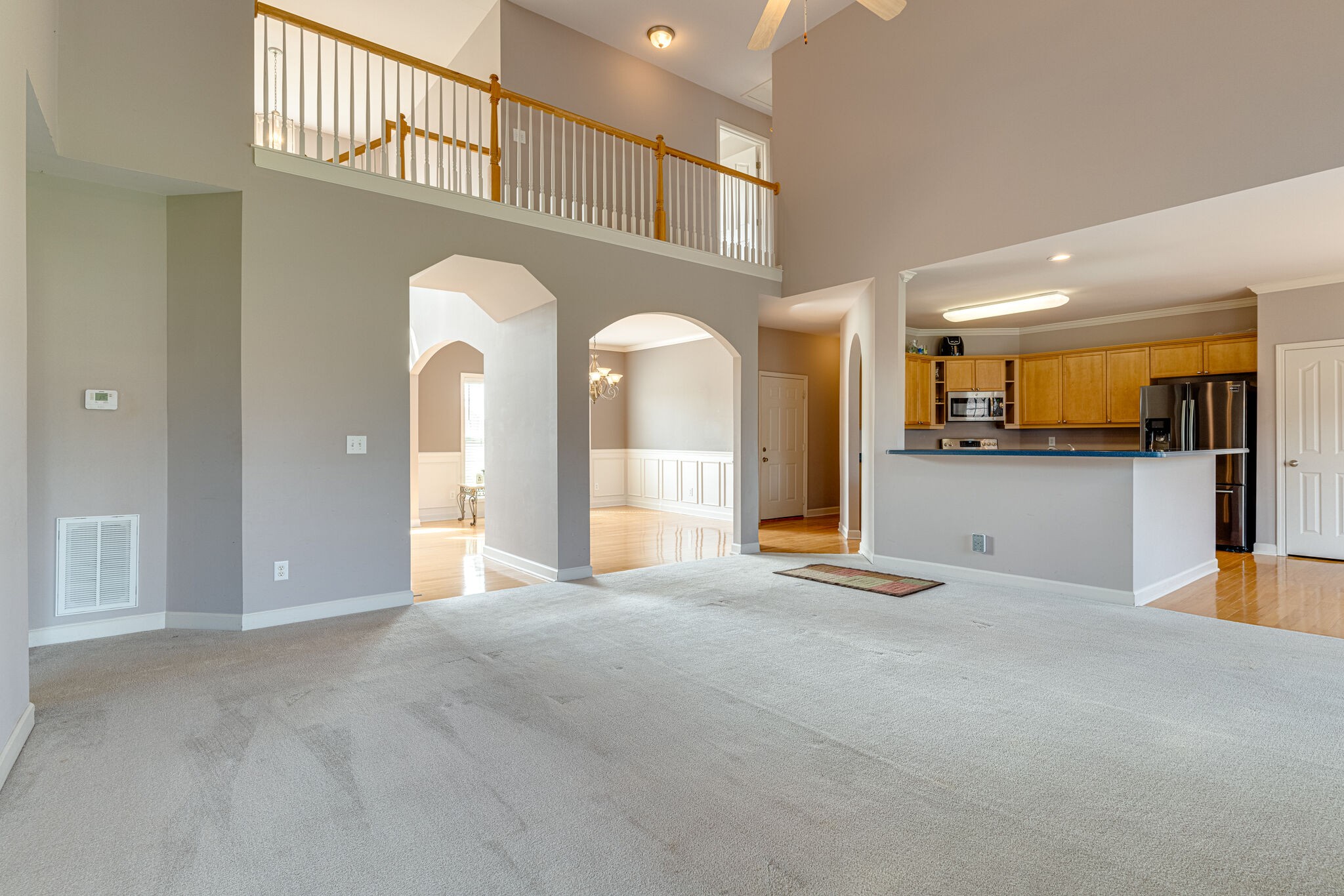 1028 Grider Drive Gallatin, TN 37066 - Photo 9 of 47 a view of a hallway with a large window and chandelier