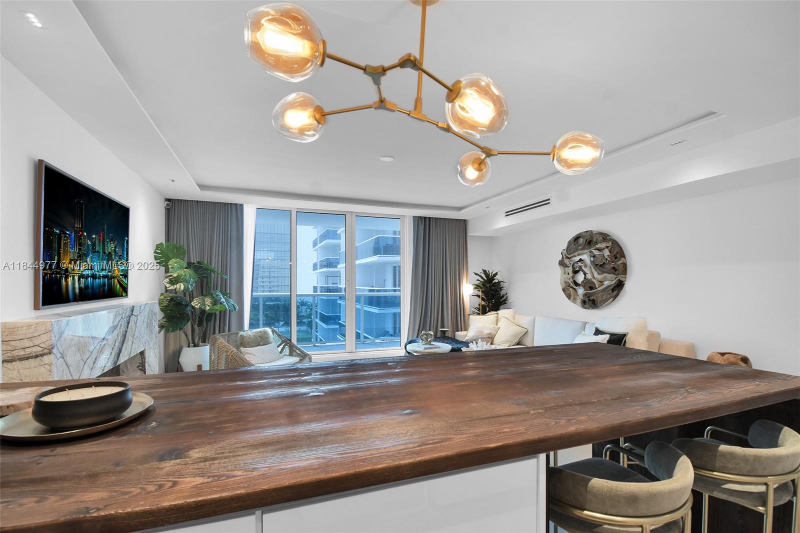 2301 Collins Avenue, Unit 1201 Miami Beach, FL 33139 - Photo 14 of 53 a view of a dining room with furniture