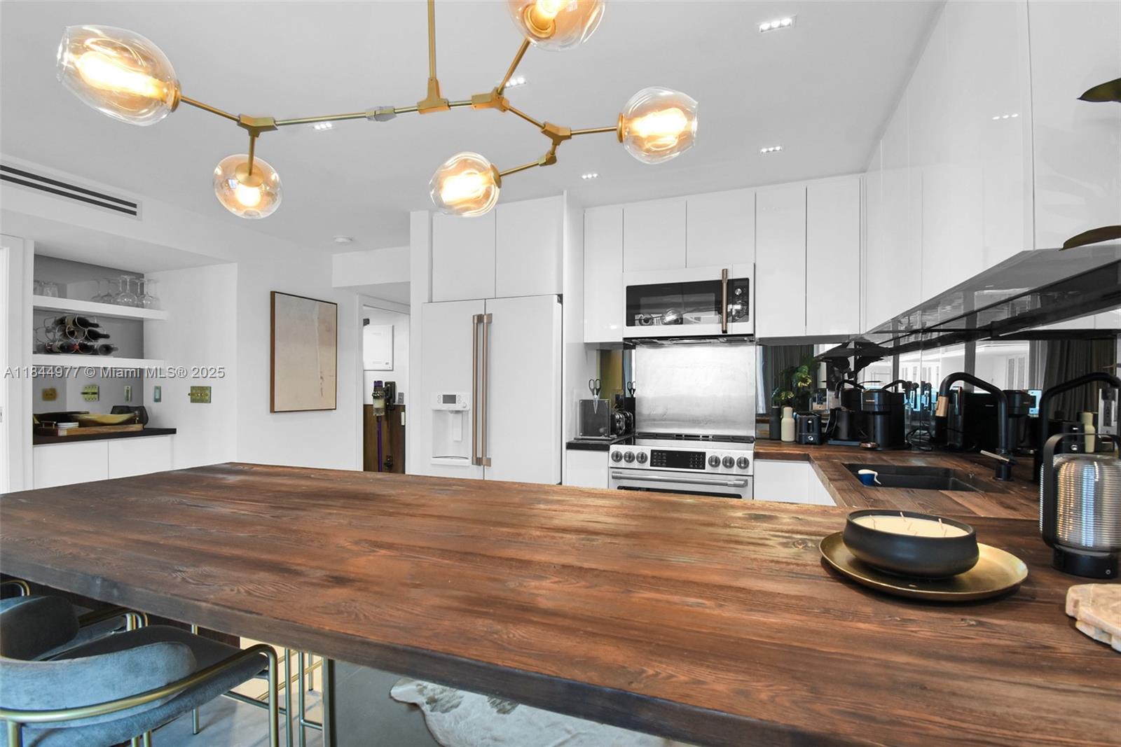 2301 Collins Avenue, Unit 1201 Miami Beach, FL 33139 - Photo 15 of 53 a room with wooden floor and gym equipment