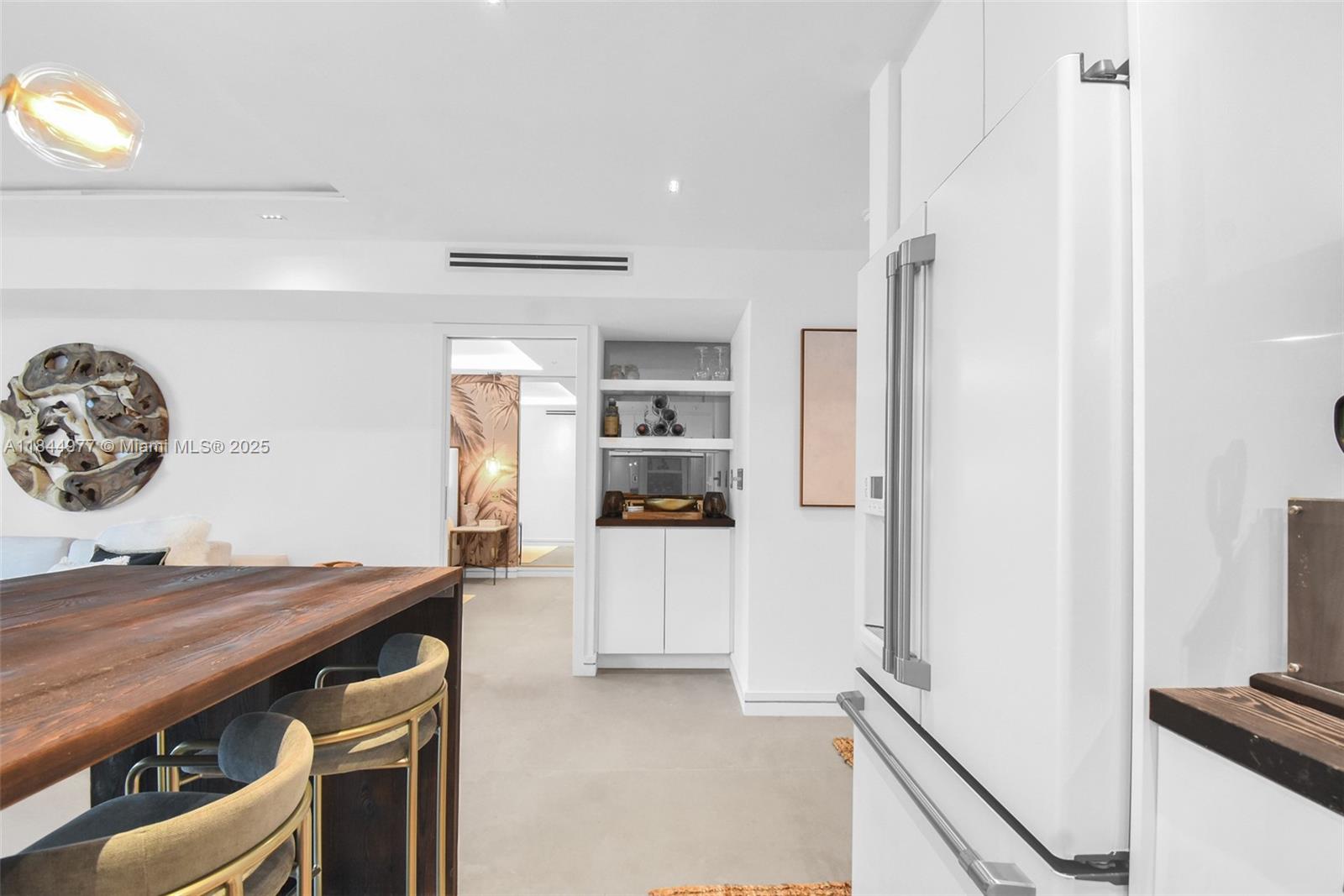 2301 Collins Avenue, Unit 1201 Miami Beach, FL 33139 - Photo 18 of 53 a kitchen with stainless steel appliances a refrigerator and a stove