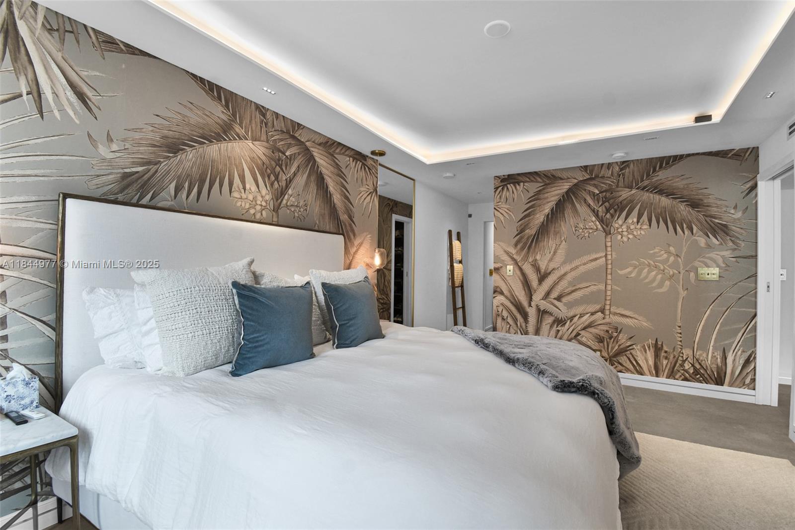 2301 Collins Avenue, Unit 1201 Miami Beach, FL 33139 - Photo 20 of 53 a bedroom with a bed and a painting on the wall