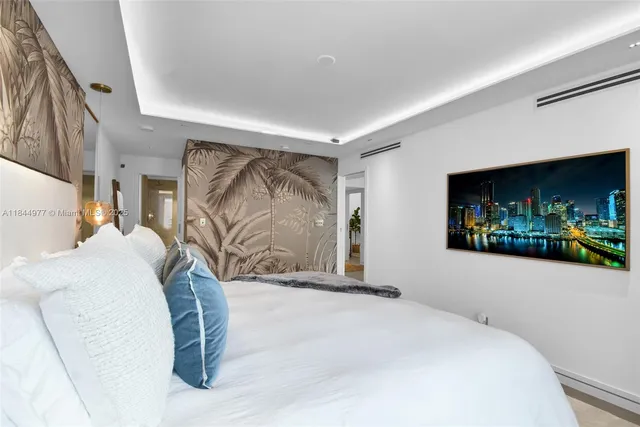 a bedroom with a bed and a couch