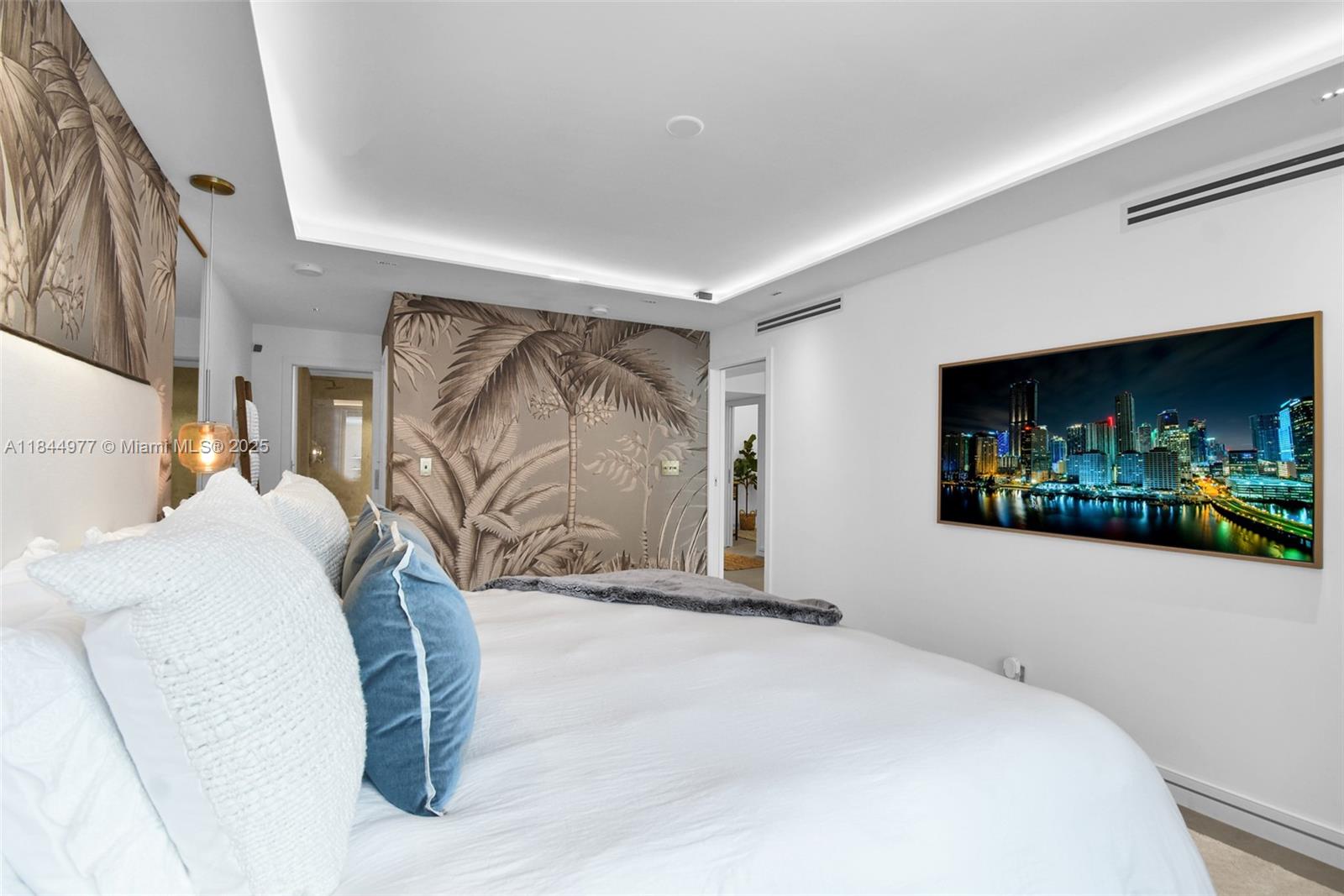 2301 Collins Avenue, Unit 1201 Miami Beach, FL 33139 - Photo 23 of 53 a bedroom with a bed and a couch