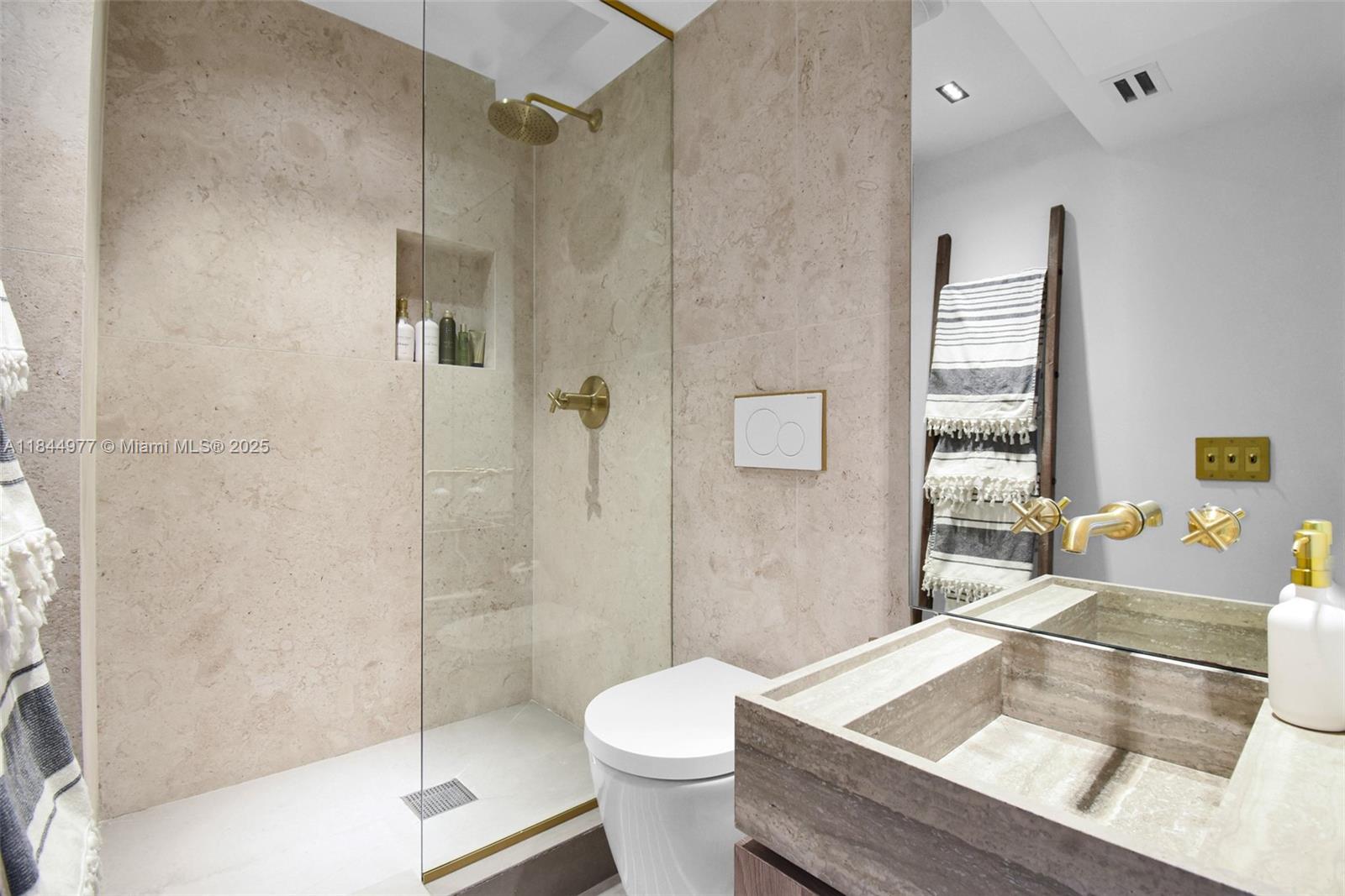 2301 Collins Avenue, Unit 1201 Miami Beach, FL 33139 - Photo 32 of 53 a bathroom with a sink toilet and shower