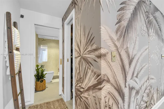 a vase of flowers sitting on a floor