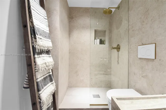 a bathroom with a bathtub and shower