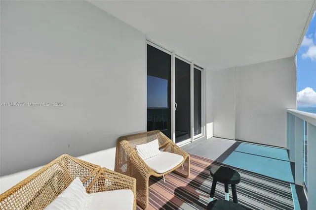 a bedroom with a bed and a table