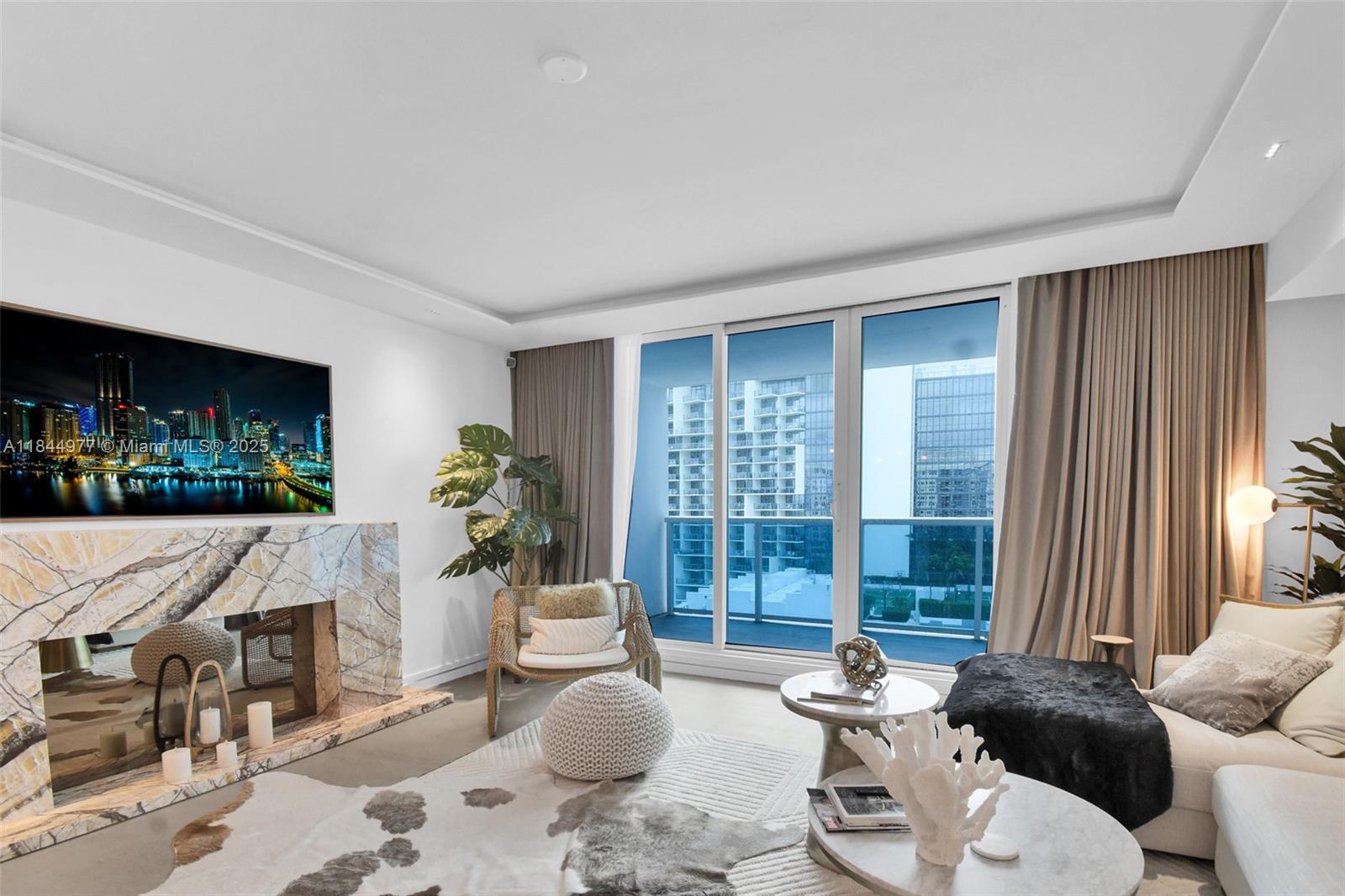 2301 Collins Avenue, Unit 1201 Miami Beach, FL 33139 - Photo 5 of 53 a living room with furniture and a large window