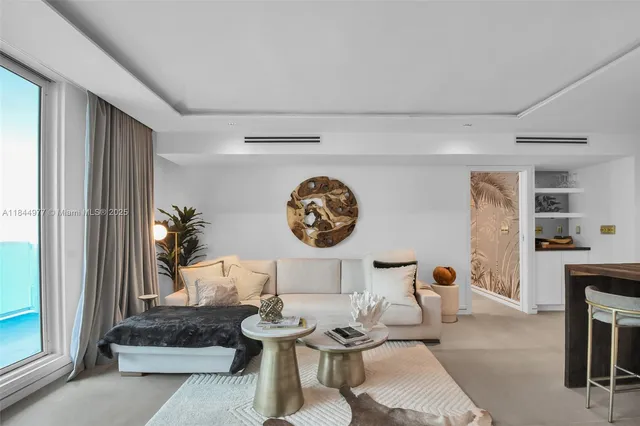 a living room with furniture and a window