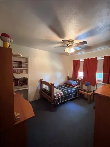 a bedroom with furniture and a window