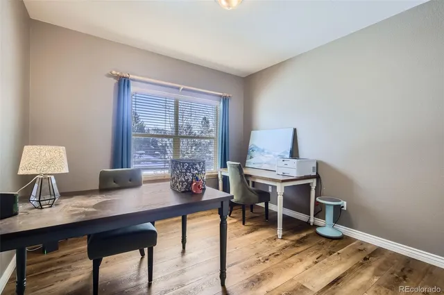 a workspace with furniture and window