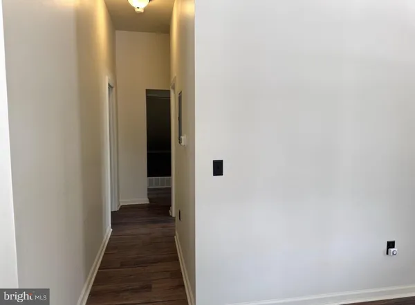 a view of a hallway with the wooden floor
