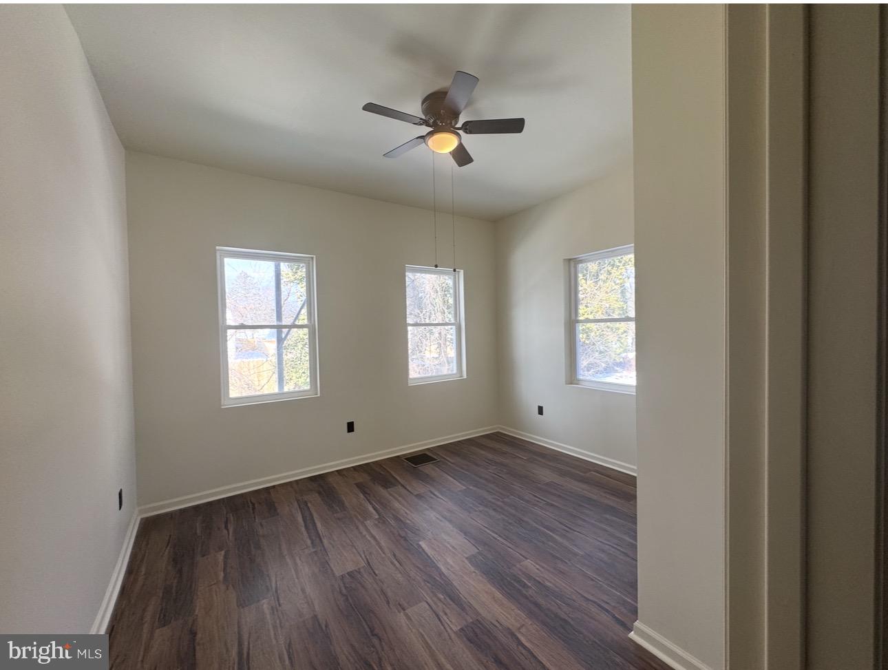 126 Washington Avenue, Unit 1A Laurel Springs, NJ 08021 - Photo 9 of 9 a view of empty room with wooden floor and fan