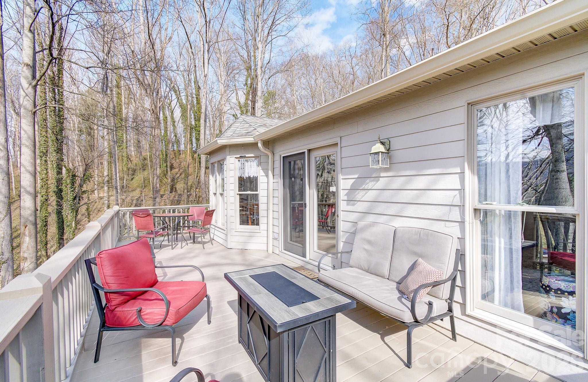 737 Woodbine Road Waynesville, NC 28785 - Photo 11 of 48 a outdoor living space with patio furniture