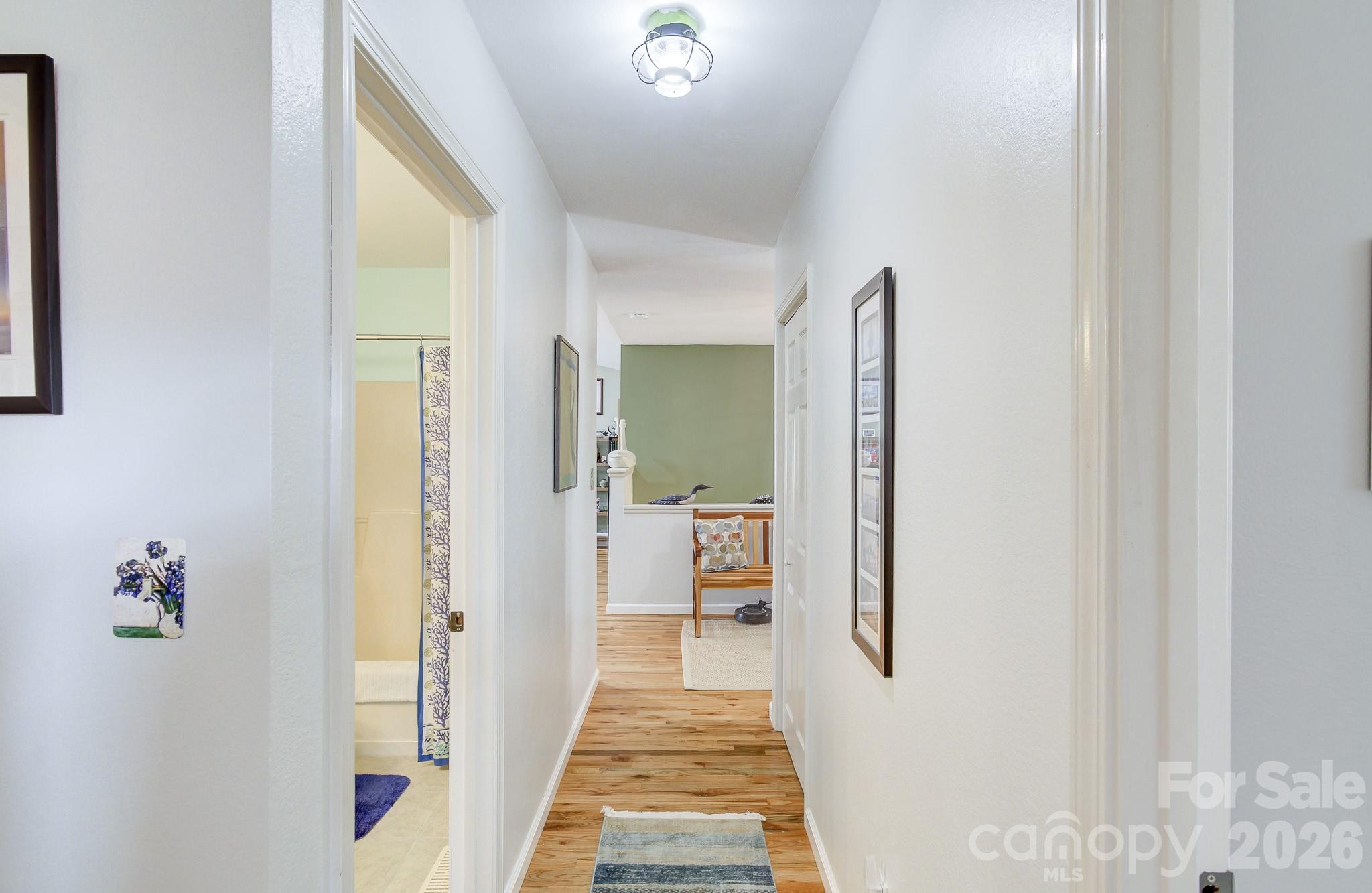 737 Woodbine Road Waynesville, NC 28785 - Photo 22 of 48 a view of a hallway with wooden floor and staircase