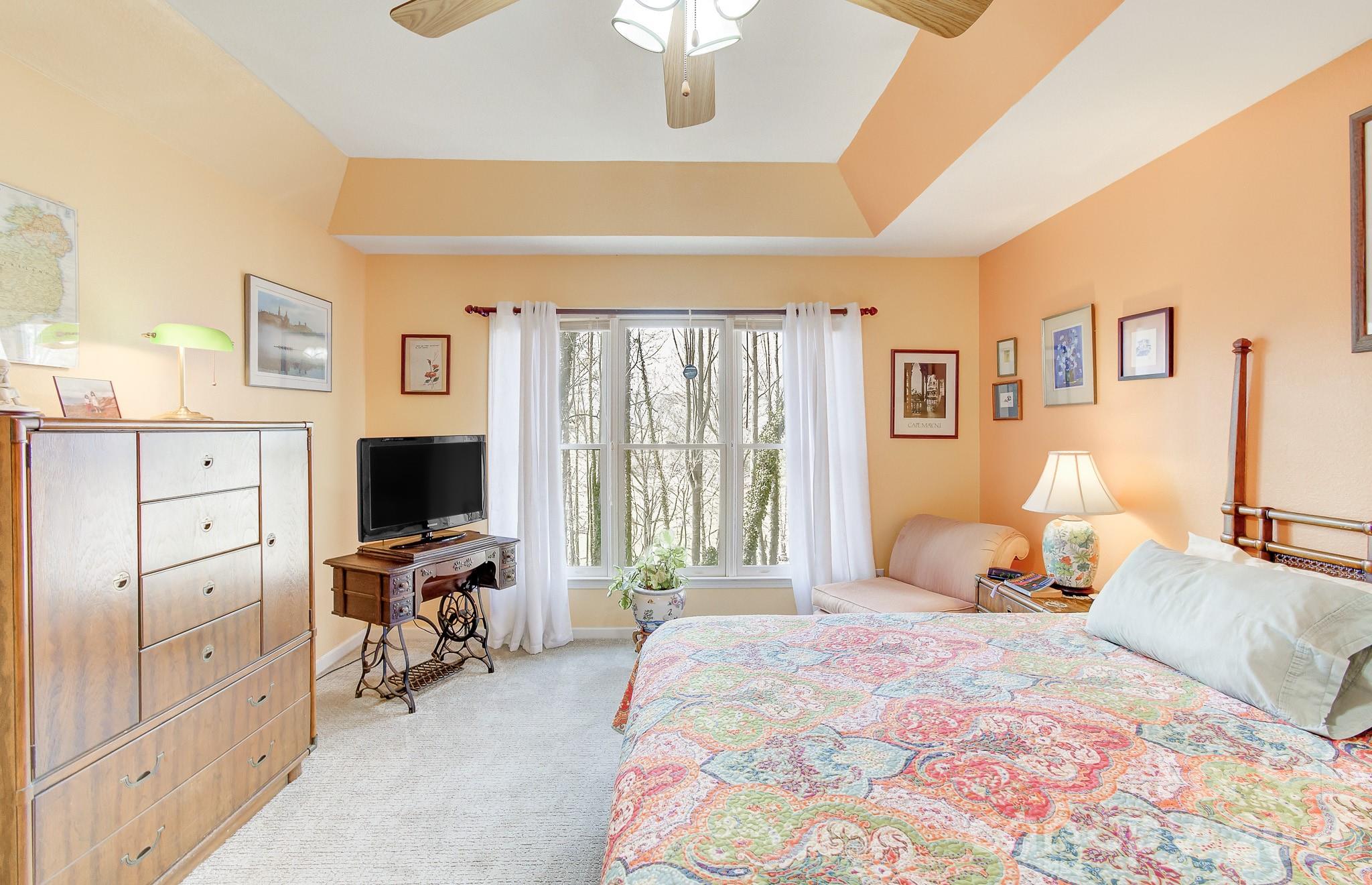 737 Woodbine Road Waynesville, NC 28785 - Photo 24 of 48 a bedroom with a bed and a flat screen tv