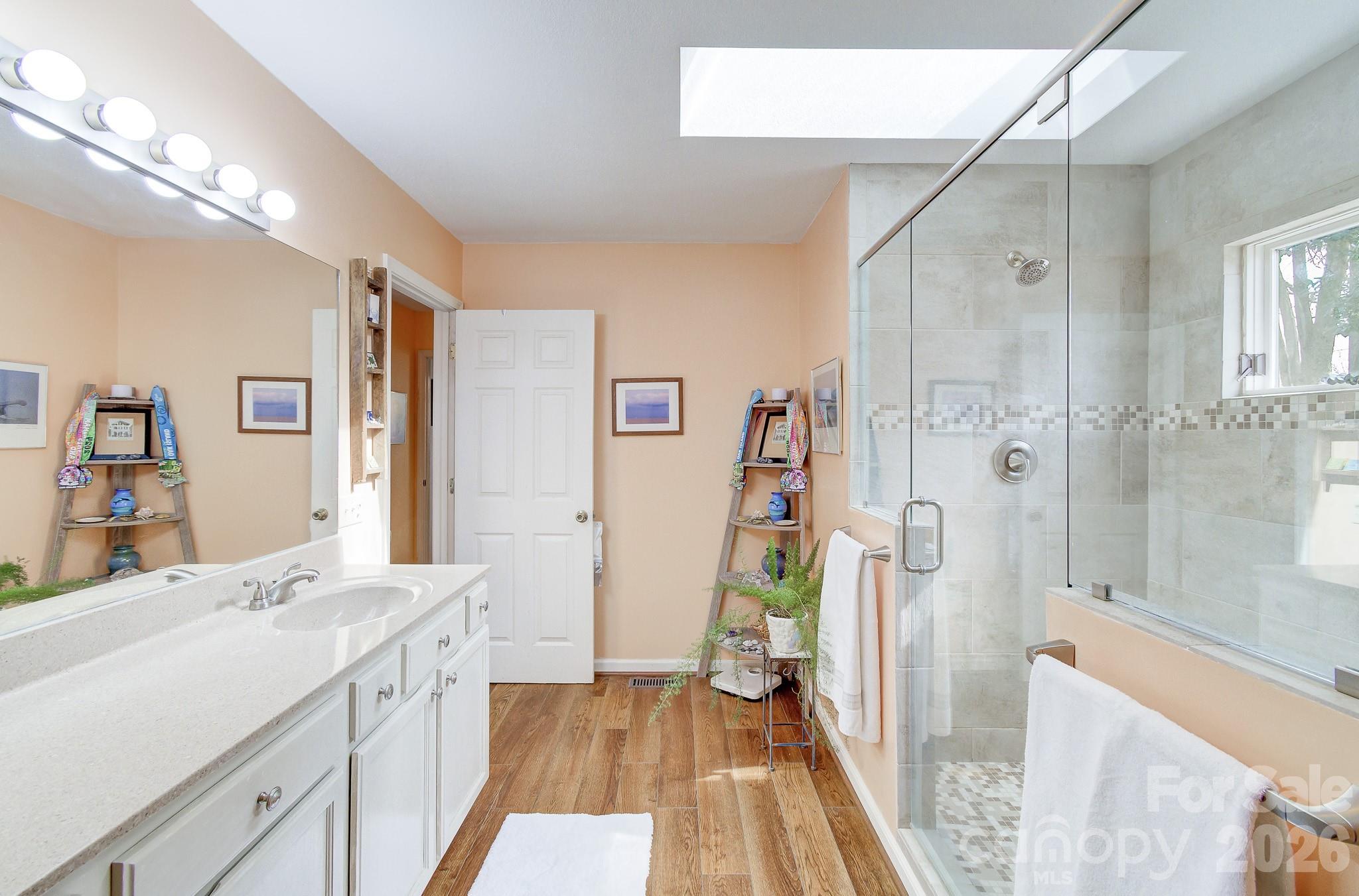 737 Woodbine Road Waynesville, NC 28785 - Photo 27 of 48 a spacious bathroom with a shower sink and toilet