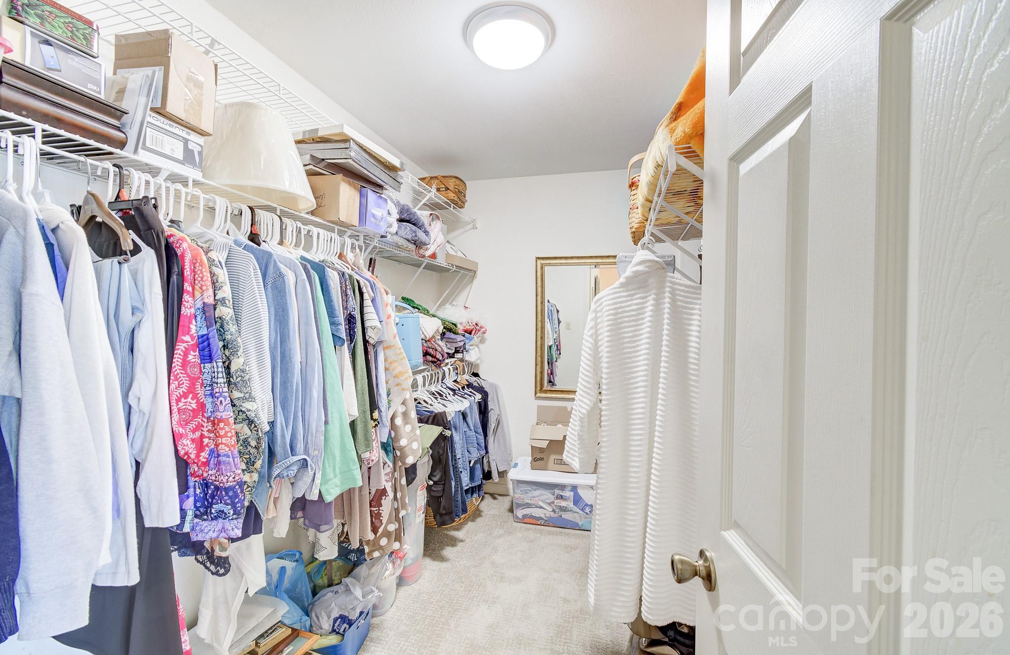737 Woodbine Road Waynesville, NC 28785 - Photo 29 of 48 a view of walk in closet with clothes