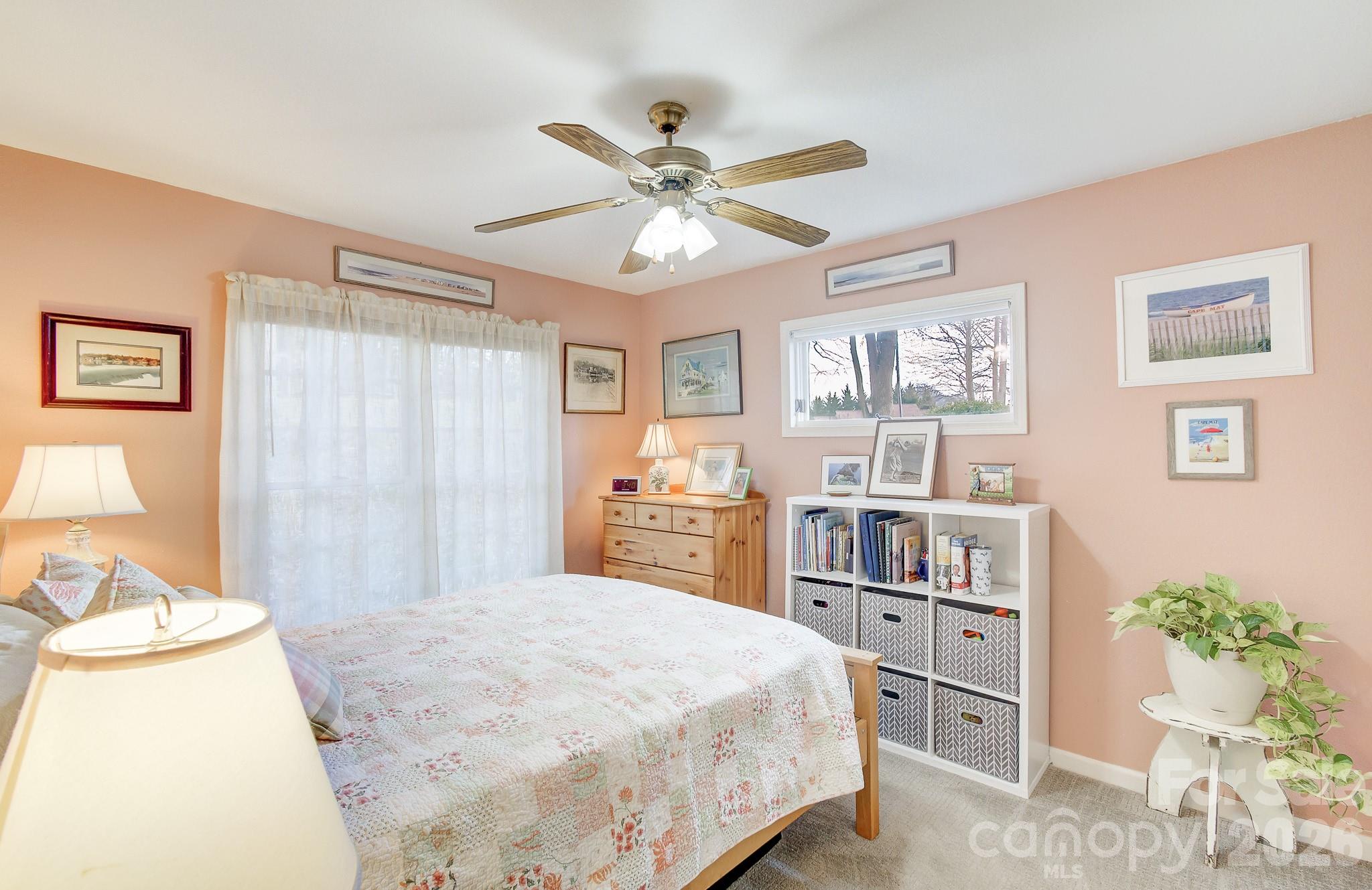 737 Woodbine Road Waynesville, NC 28785 - Photo 33 of 48 a bedroom with a bed and cabinets