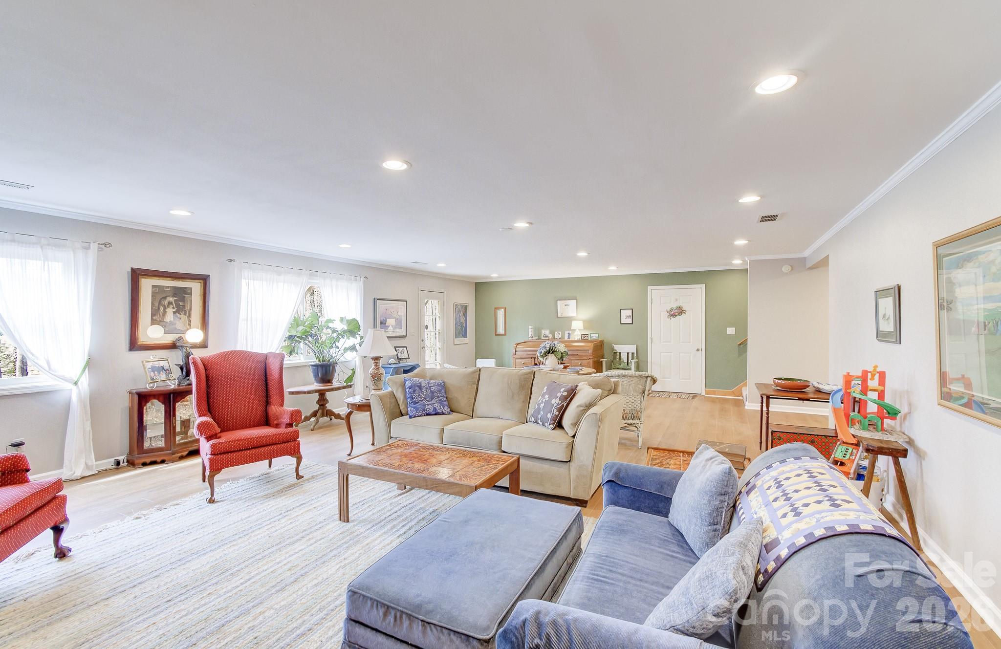 737 Woodbine Road Waynesville, NC 28785 - Photo 36 of 48 a living room with furniture and wooden floor