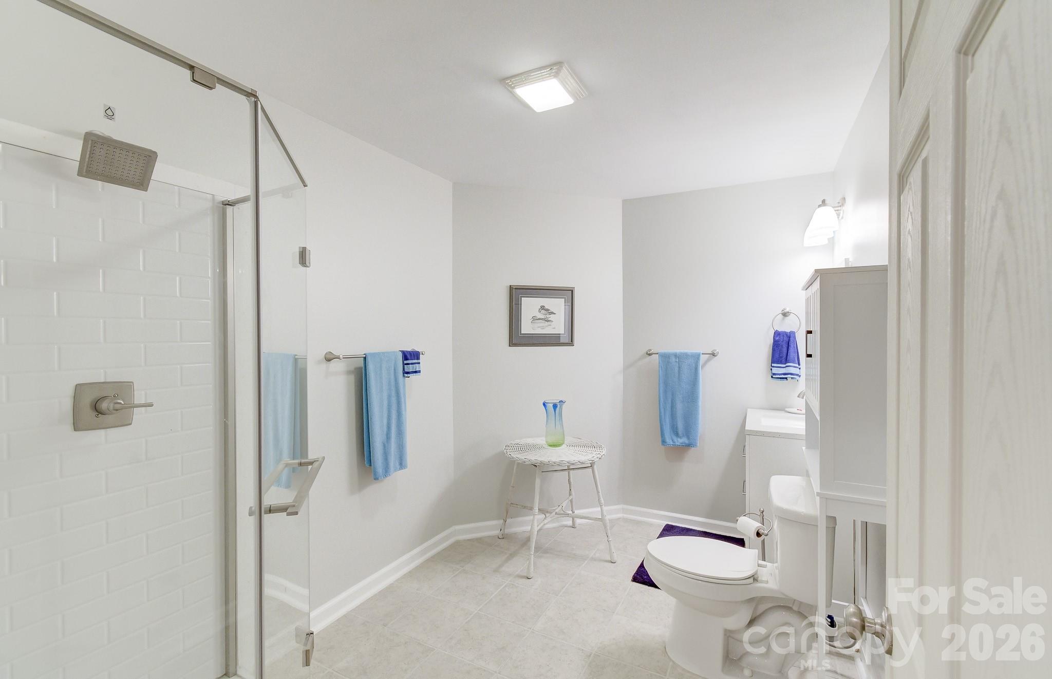 737 Woodbine Road Waynesville, NC 28785 - Photo 41 of 48 a bathroom with a sink toilet and shower