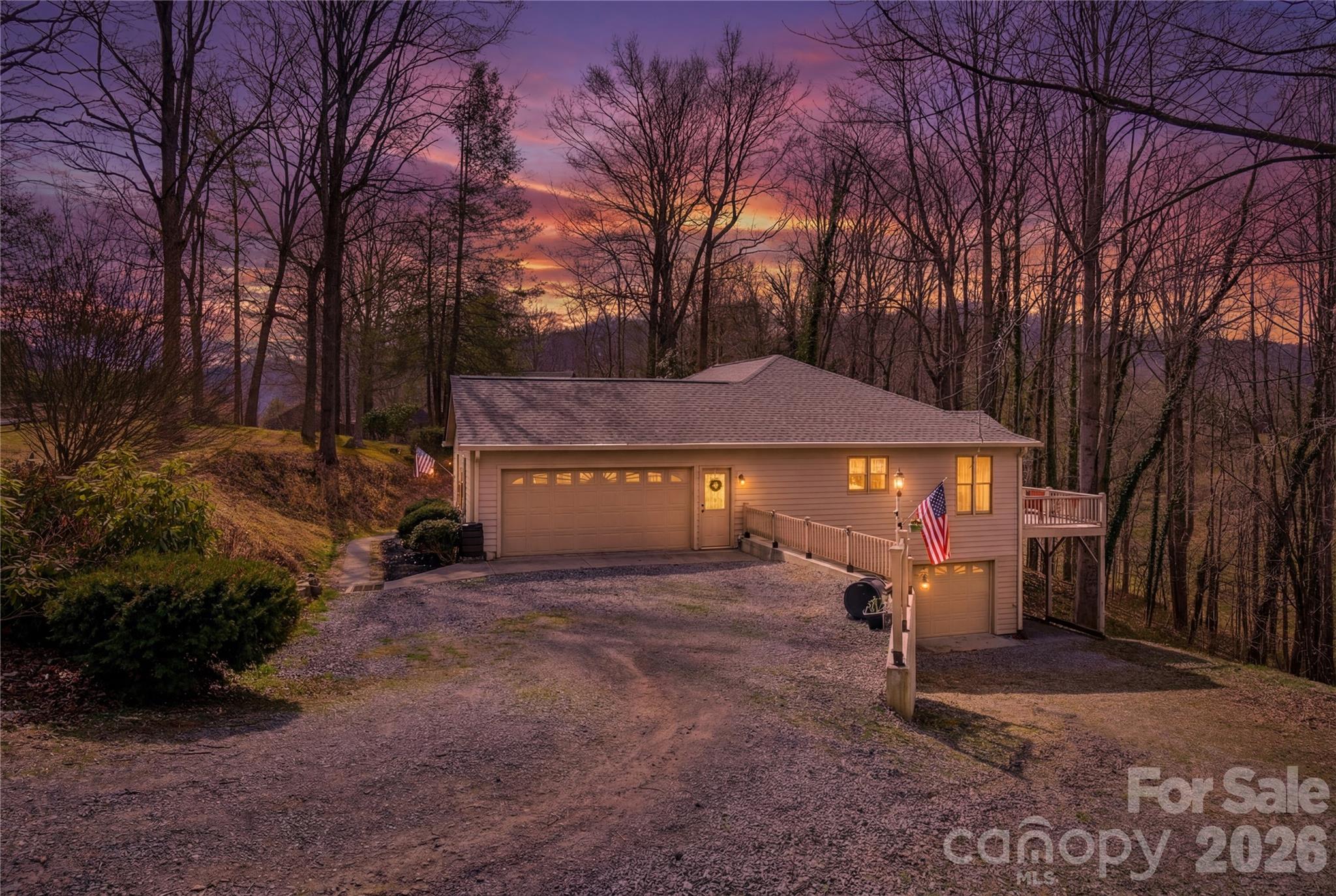 737 Woodbine Road Waynesville, NC 28785 - Photo 47 of 48 a view of a house with a yard