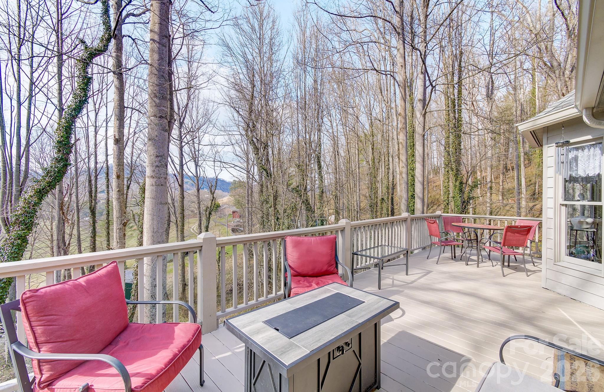 737 Woodbine Road Waynesville, NC 28785 - Photo 10 of 48 an outdoor sitting area with chairs