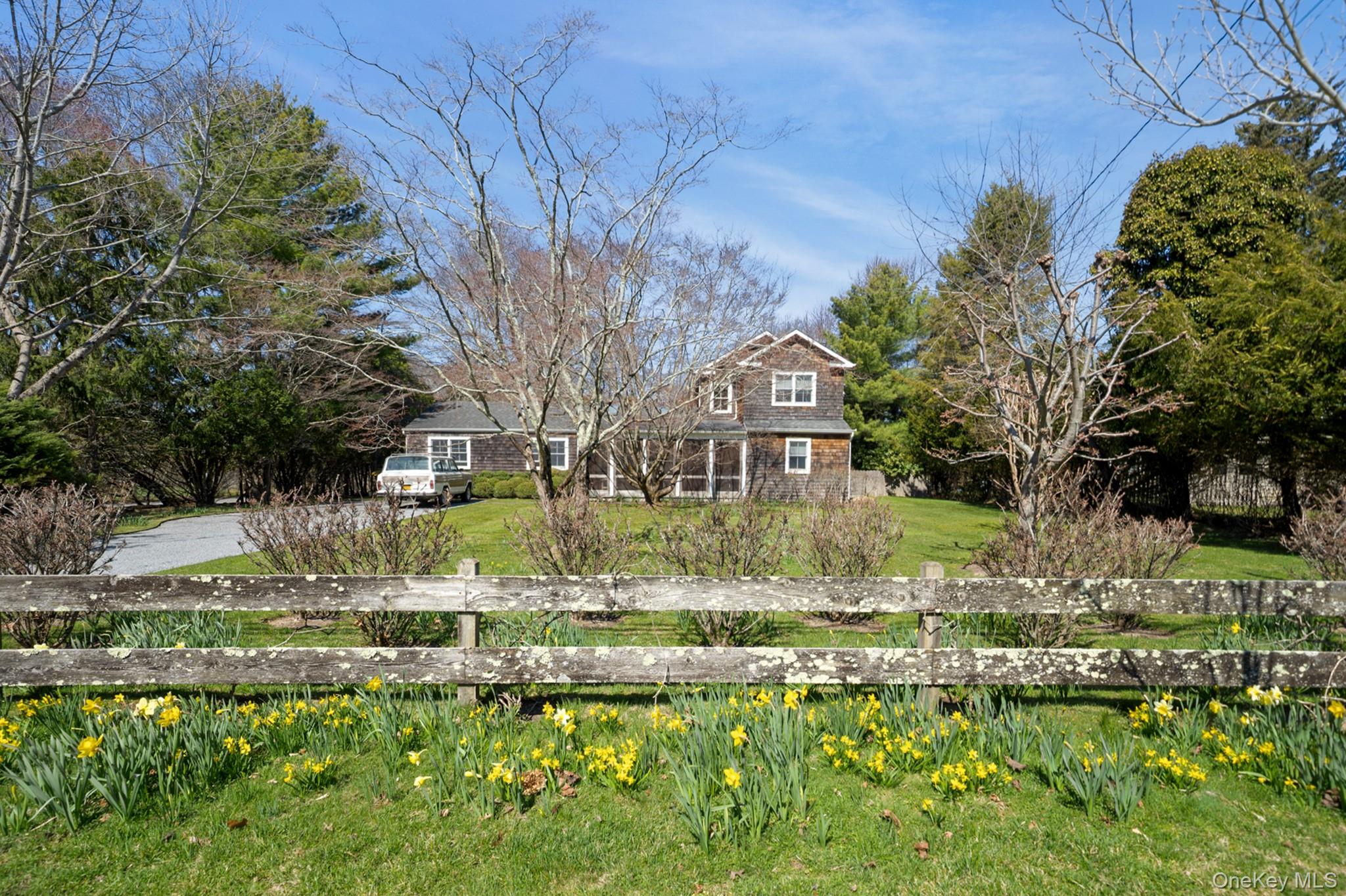 36 South Howells Point Road Bellport, NY 11713 - Photo 1 of 29 a view of a house with a yard