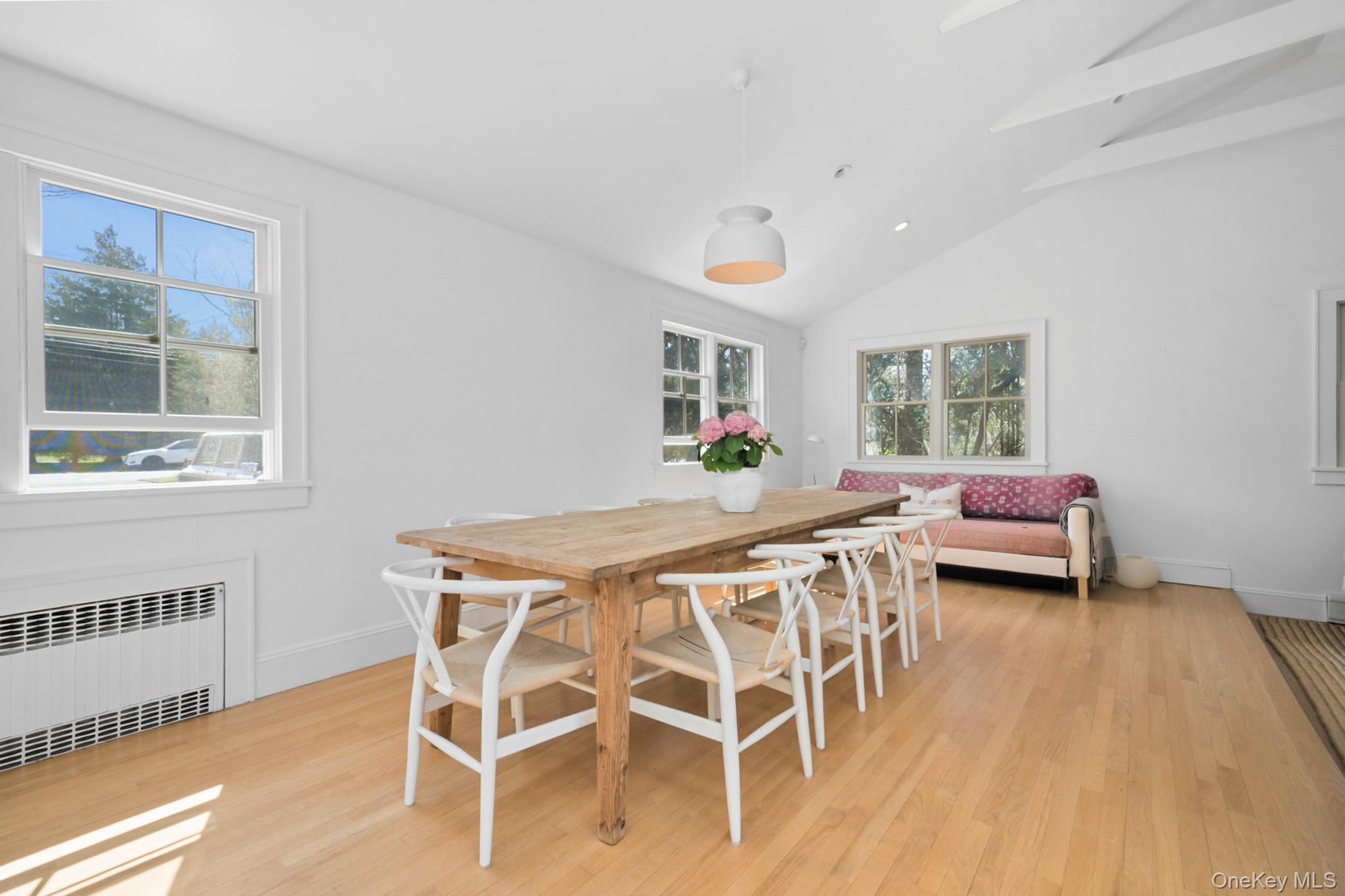 36 South Howells Point Road Bellport, NY 11713 - Photo 11 of 29 a view of a dining room with furniture and a window