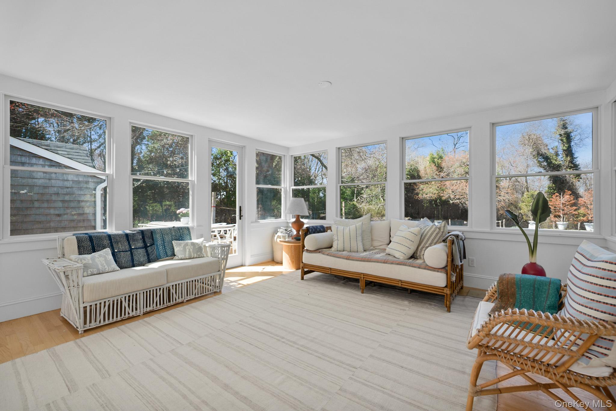 36 South Howells Point Road Bellport, NY 11713 - Photo 12 of 29 a living room with furniture and a large window