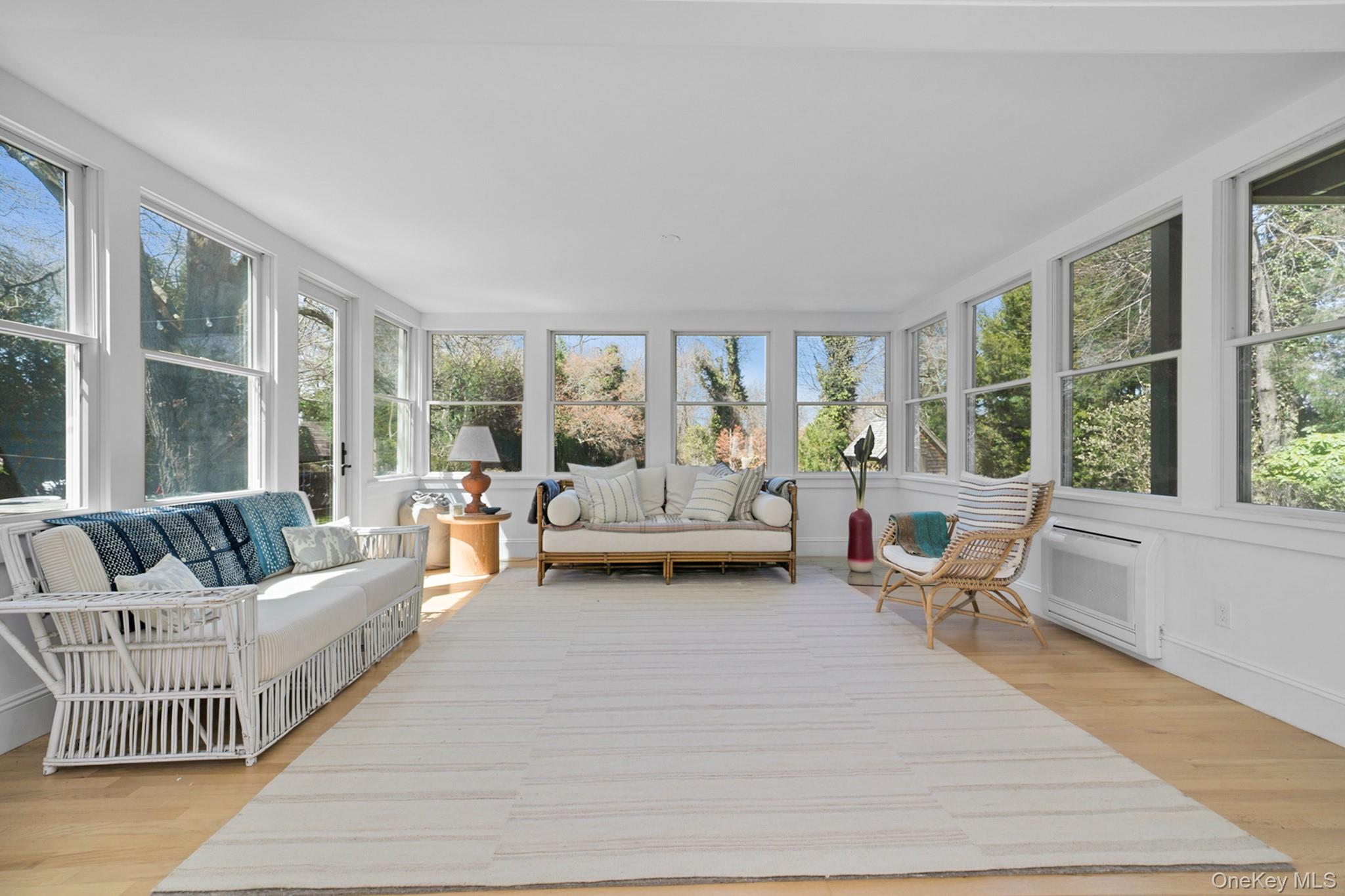 36 South Howells Point Road Bellport, NY 11713 - Photo 13 of 29 a living room with furniture and large windows