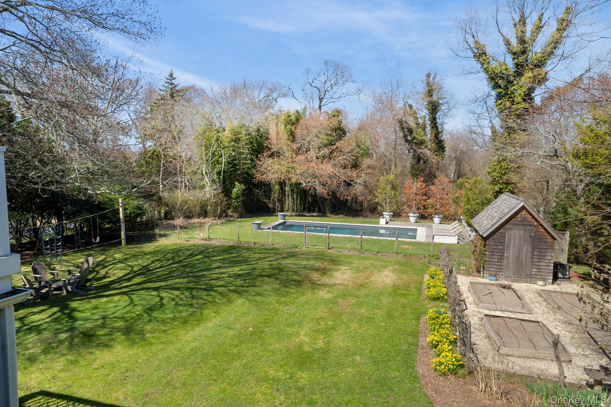 36 South Howells Point Road Bellport, NY 11713 - Photo 19 of 29 a view of a house with a big yard